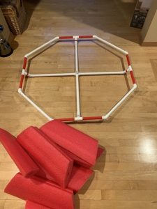 Frame of 48-inch SKWIM goal with red foam pieces